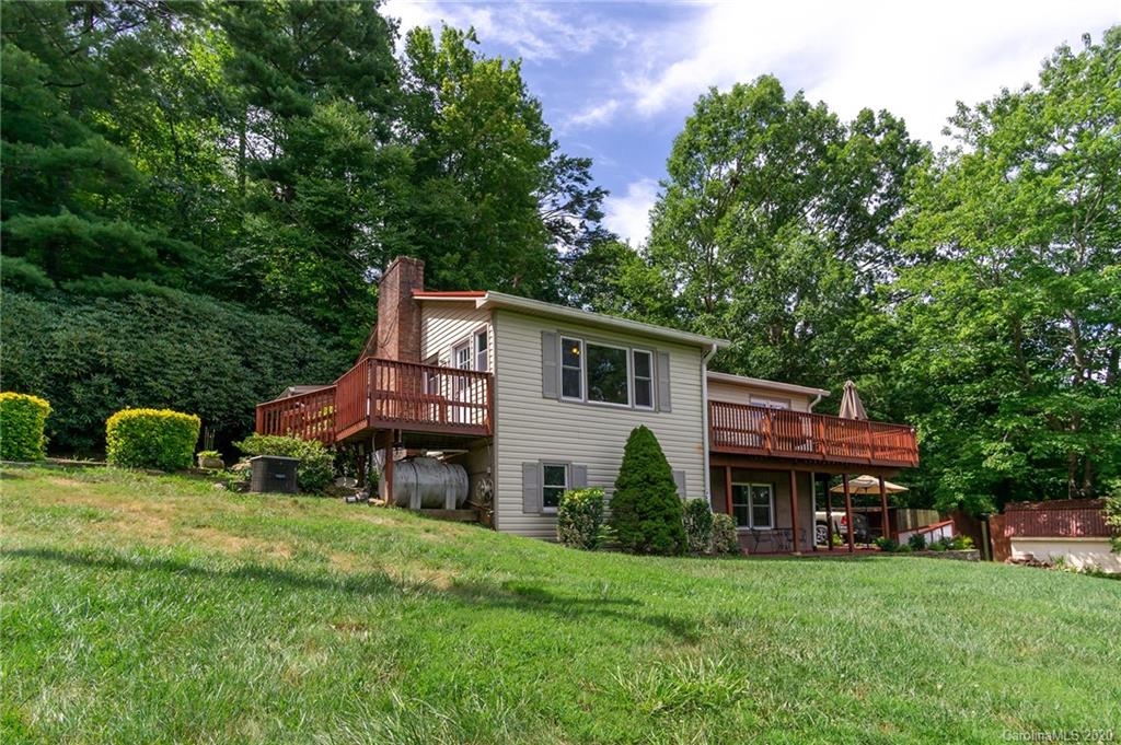27 New Valley Road Swannanoa, NC 28778 - Photo 1 of 42 a view of a house with backyard and sitting area