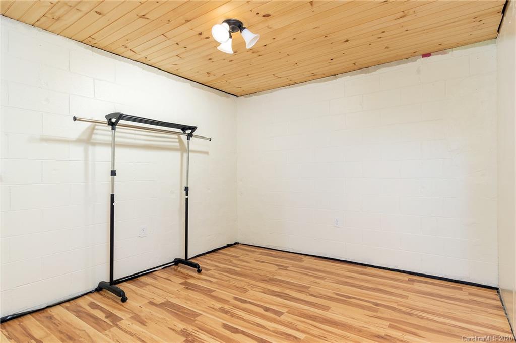 27 New Valley Road Swannanoa, NC 28778 - Photo 21 of 42 a view of empty room with wooden floor