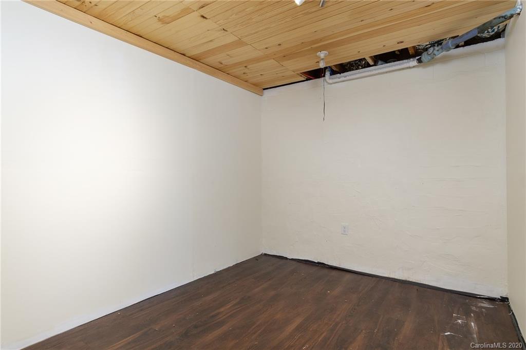 27 New Valley Road Swannanoa, NC 28778 - Photo 22 of 42 an empty room with wooden floor