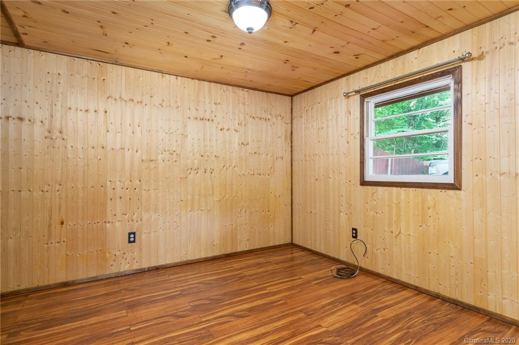 27 New Valley Road Swannanoa, NC 28778 - Photo 24 of 42 a view of a livingroom with wooden floor and a window