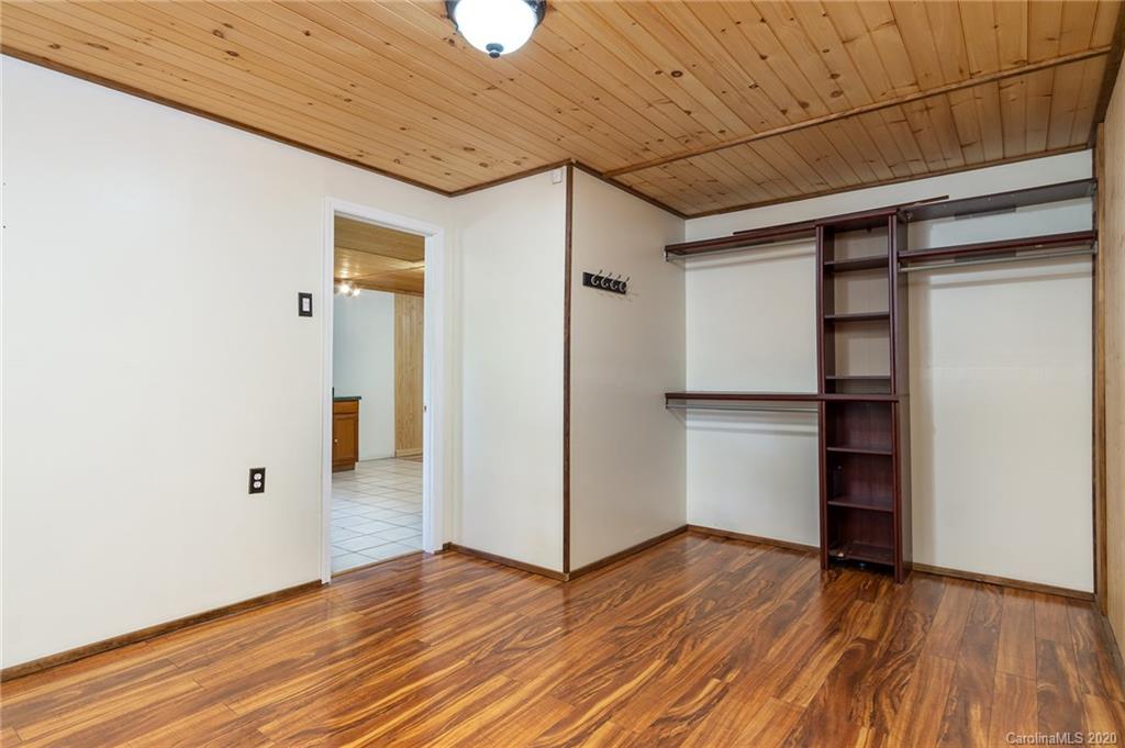 27 New Valley Road Swannanoa, NC 28778 - Photo 25 of 42 a view of empty room with wooden floor