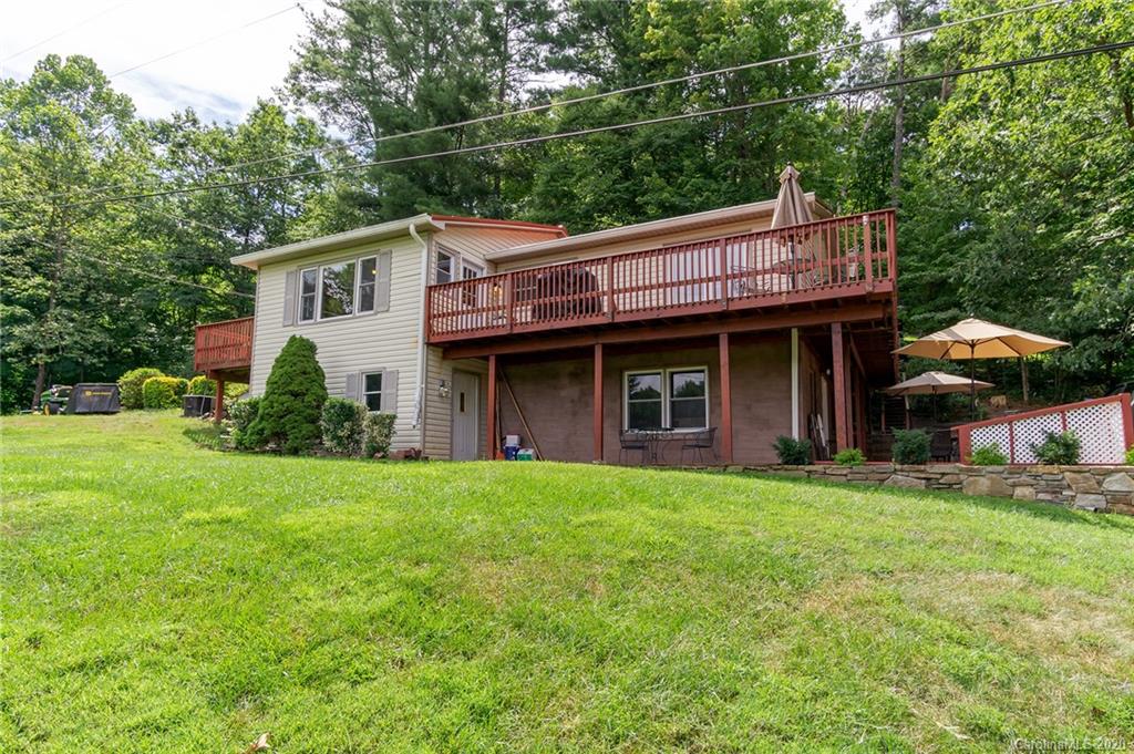 27 New Valley Road Swannanoa, NC 28778 - Photo 30 of 42 a view of a house with a yard and plants