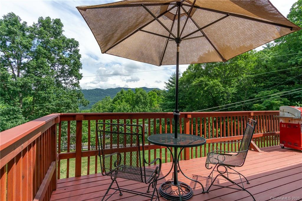 27 New Valley Road Swannanoa, NC 28778 - Photo 33 of 42 a view of a deck with furniture and wooden deck