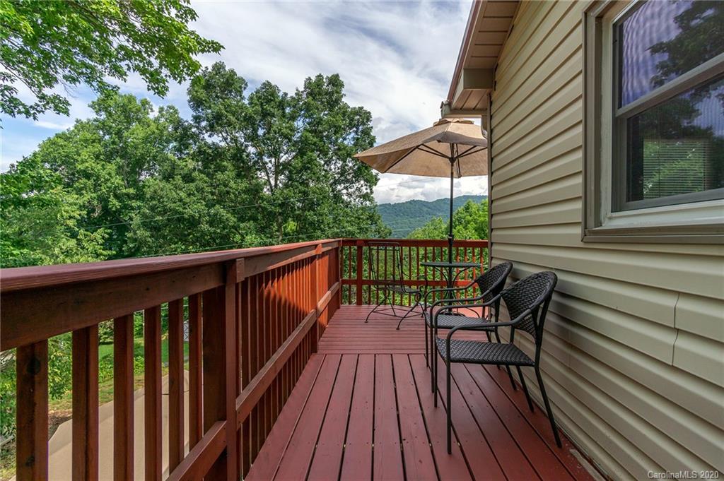 27 New Valley Road Swannanoa, NC 28778 - Photo 34 of 42 a view of a two chairs on the roof deck