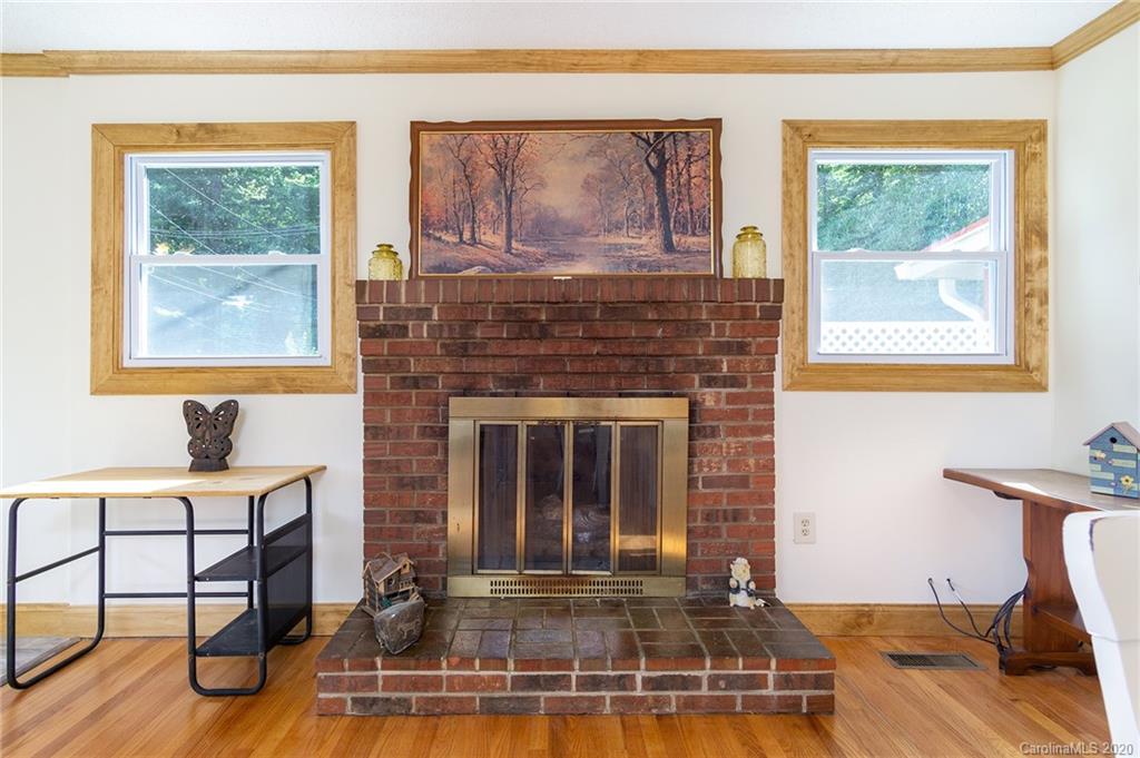 27 New Valley Road Swannanoa, NC 28778 - Photo 7 of 42 a living room with furniture and a fireplace