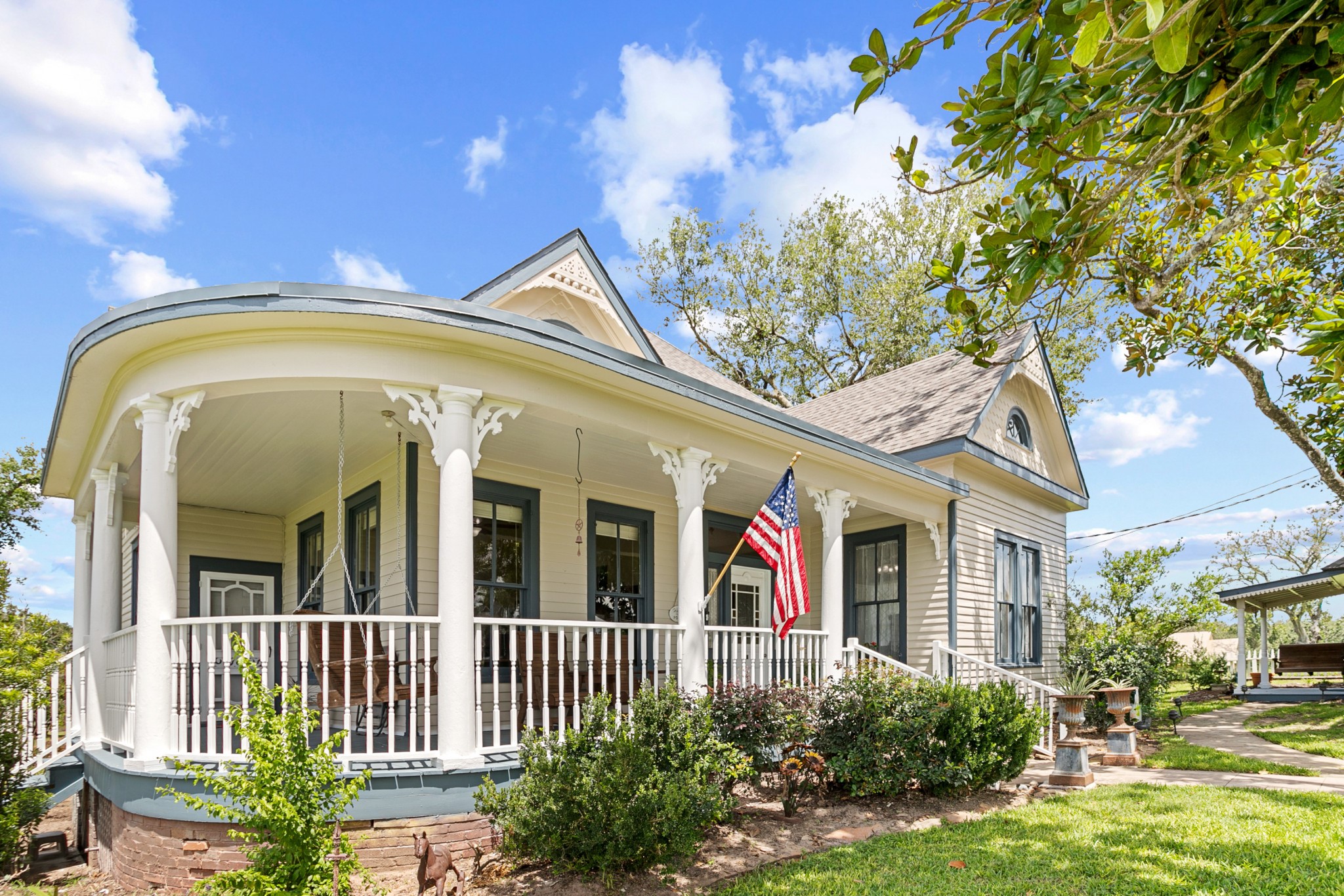 1034 South Tesch Street Bellville, TX 77418 - Photo 2 of 44 Side view of wraparound front porch.