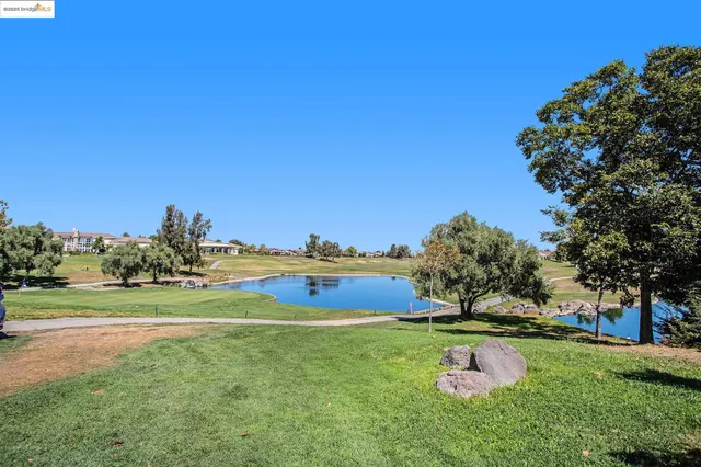 a view of a golf course with a lake view