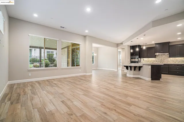 a view of kitchen with wooden floor