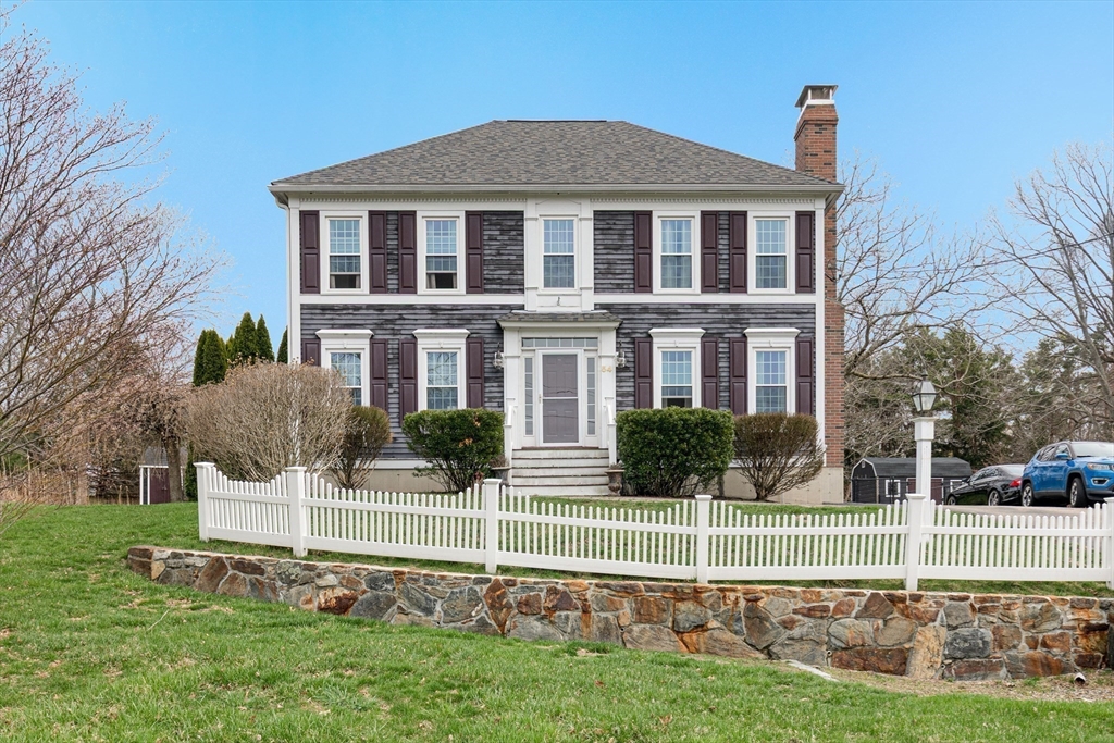 54 Old Merrill Street Amesbury, MA 01913 - Photo 3 of 34 a front view of a house with a yard