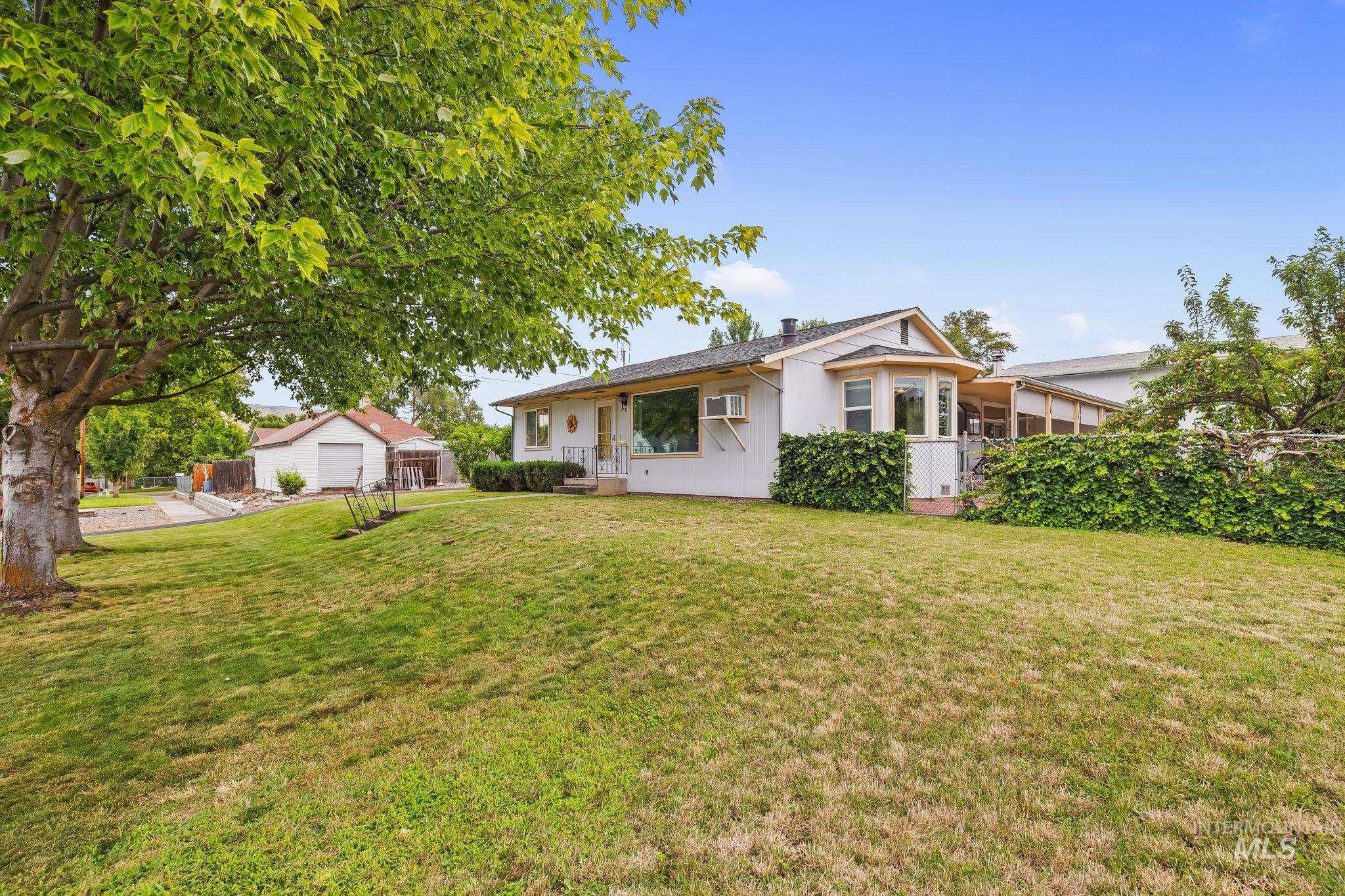 1721 3rd Street Lewiston, ID 83501 - Photo 17 of 45 Expansive front lawn with mature trees and a detached garage structure
