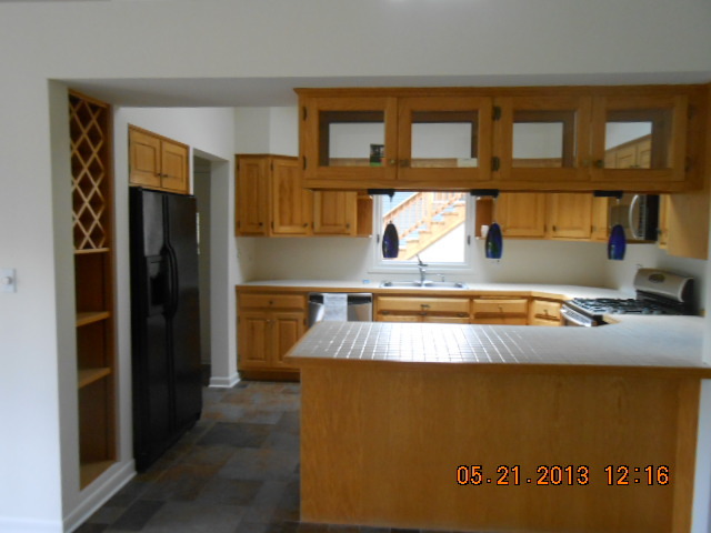 1512 Daly Road Wheaton, IL 60187 - Photo 11 of 20 a view of kitchen with stainless steel appliances granite countertop refrigerator a sink and dishwasher