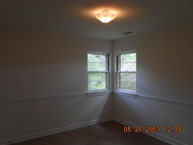 1512 Daly Road Wheaton, IL 60187 - Photo 14 of 20 an empty room with windows