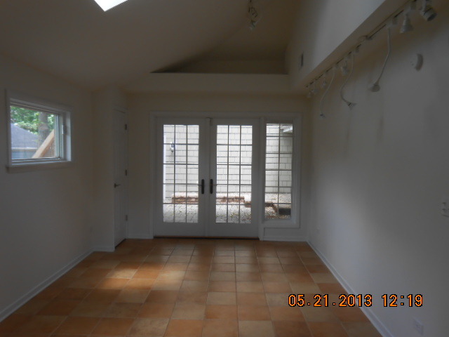 1512 Daly Road Wheaton, IL 60187 - Photo 4 of 20 an empty room with windows