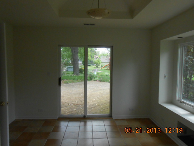 1512 Daly Road Wheaton, IL 60187 - Photo 5 of 20 an empty room with windows