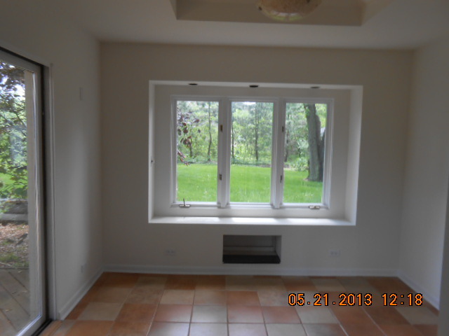 1512 Daly Road Wheaton, IL 60187 - Photo 6 of 20 a view of an empty room with a window