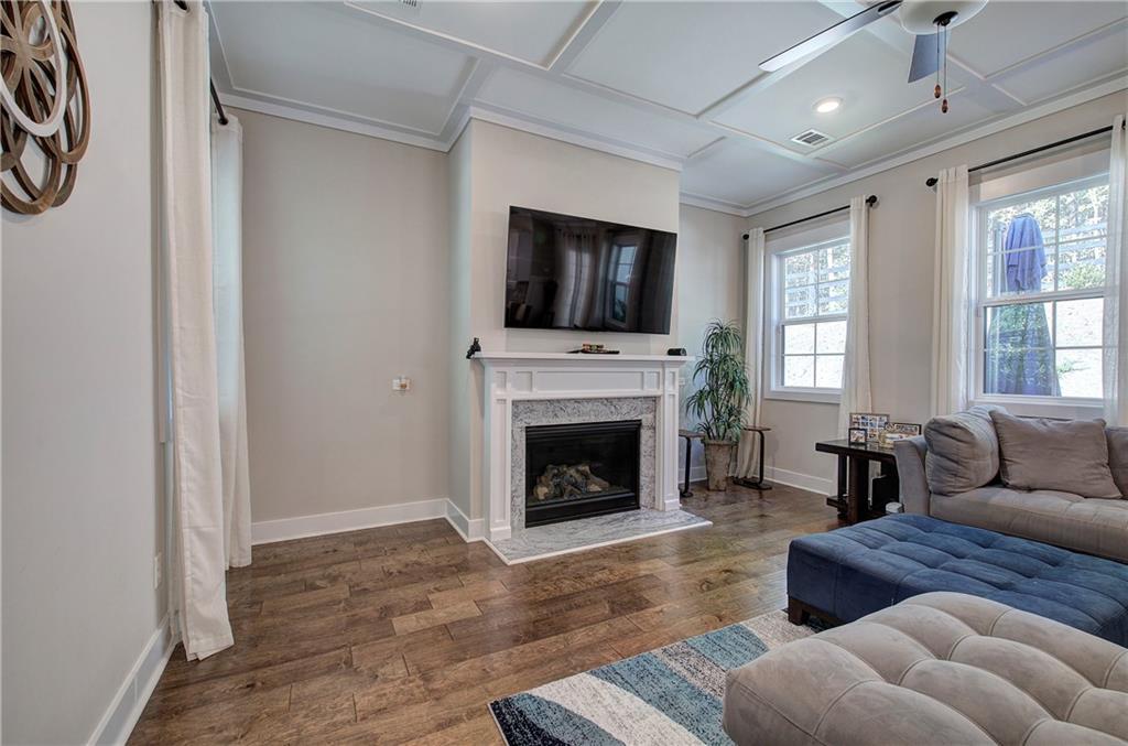 503 London Road Ball Ground, GA 30107 - Photo 7 of 55 a living room with furniture and a fireplace