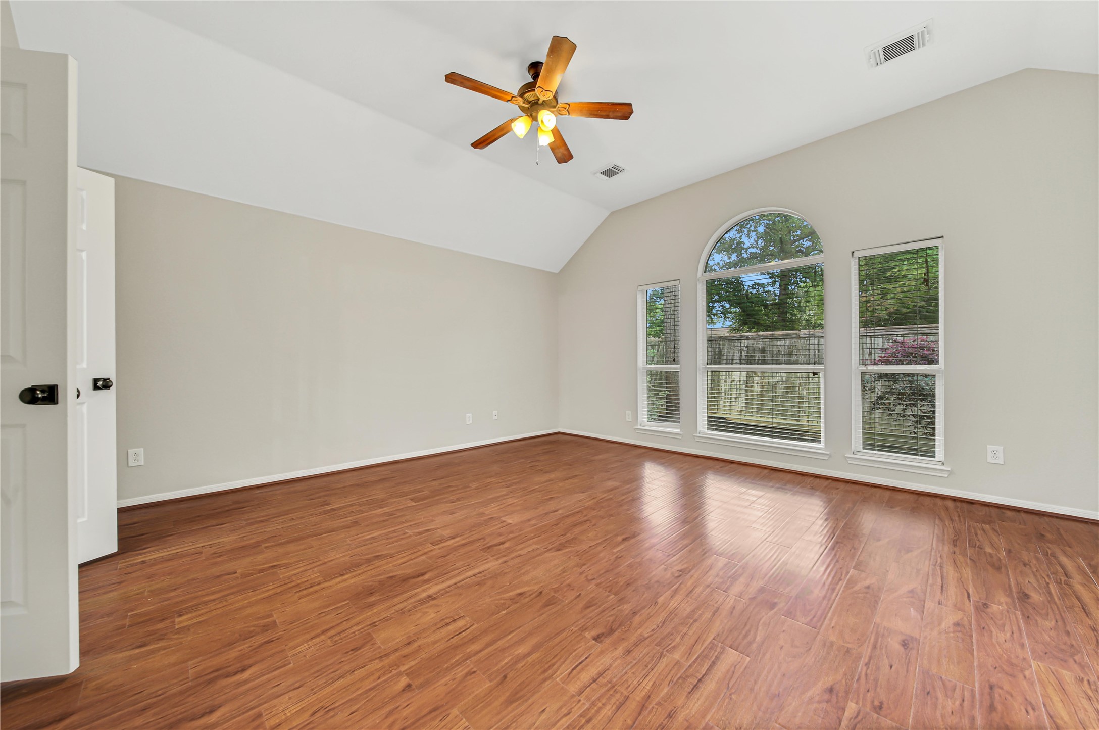 14526 Red Tailed Hawk Lane Houston, TX 77044 - Photo 40 of 40 an empty room with wooden floor and windows