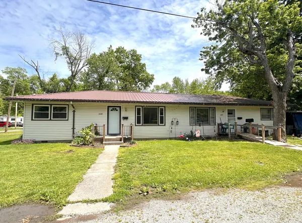a view of a house with swimming pool in front of it