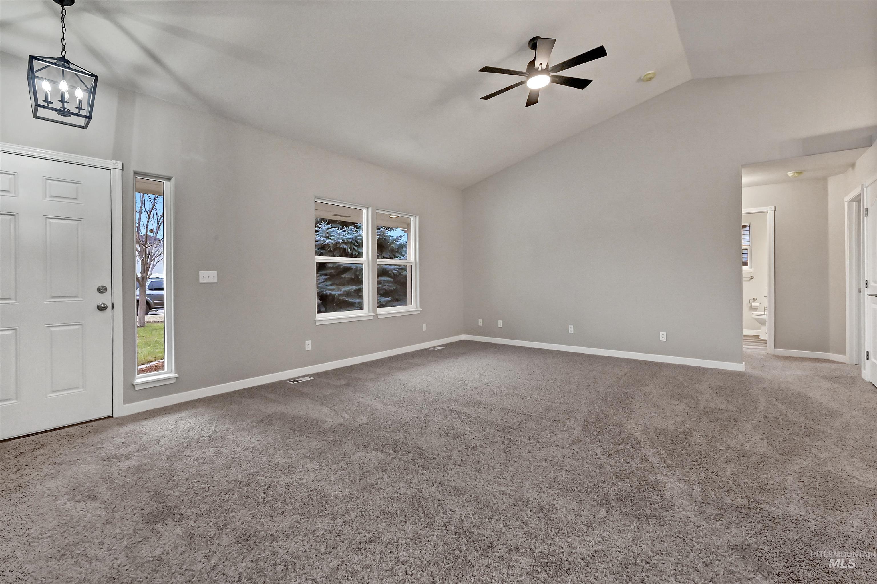 366 West Harris Street Meridian, ID 83642 - Photo 11 of 31 Foyer with light carpet, lofted ceiling, and ceiling fan