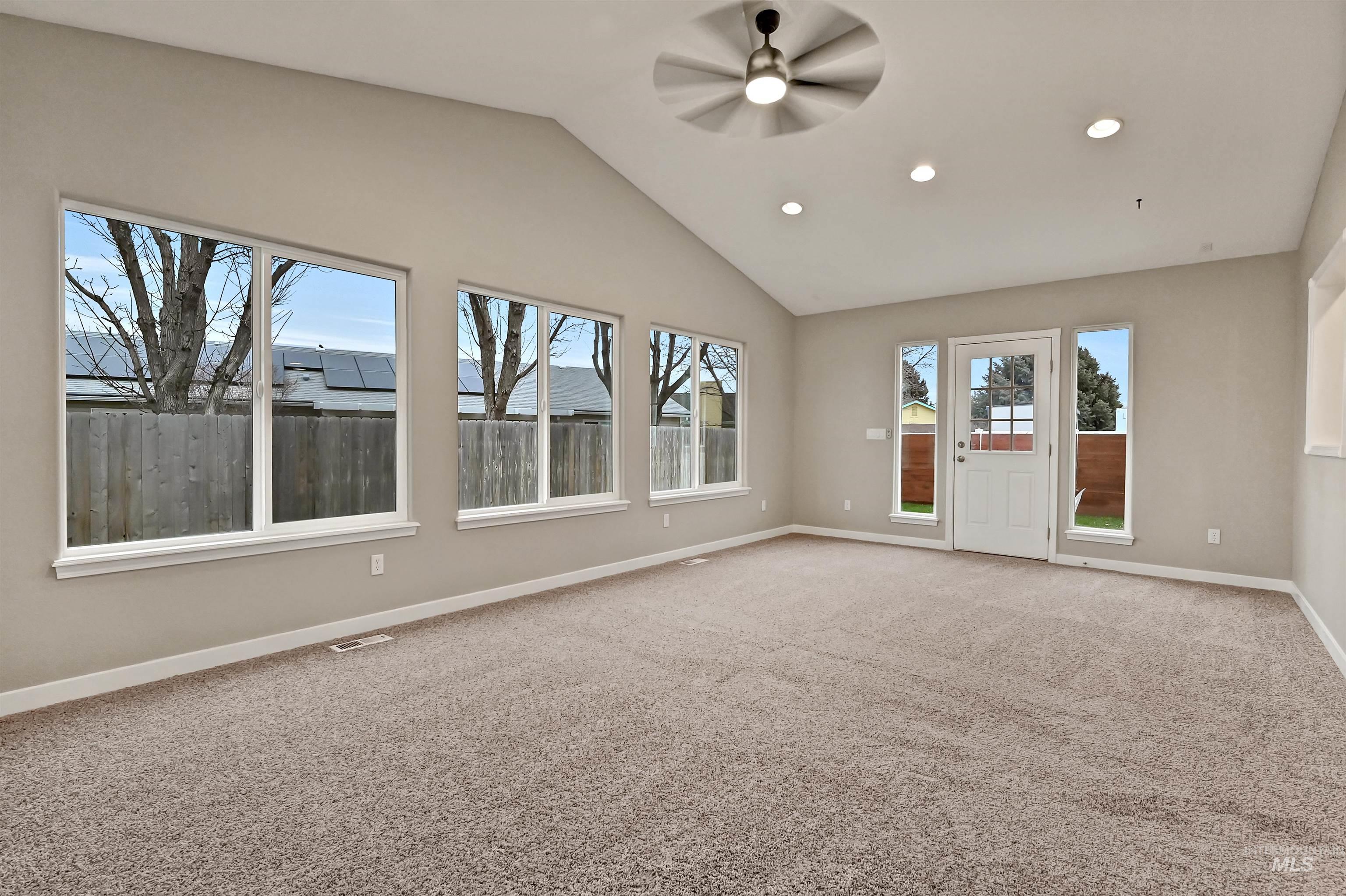 366 West Harris Street Meridian, ID 83642 - Photo 14 of 31 Spare room with lofted ceiling, light carpet, a ceiling fan, and recessed lighting