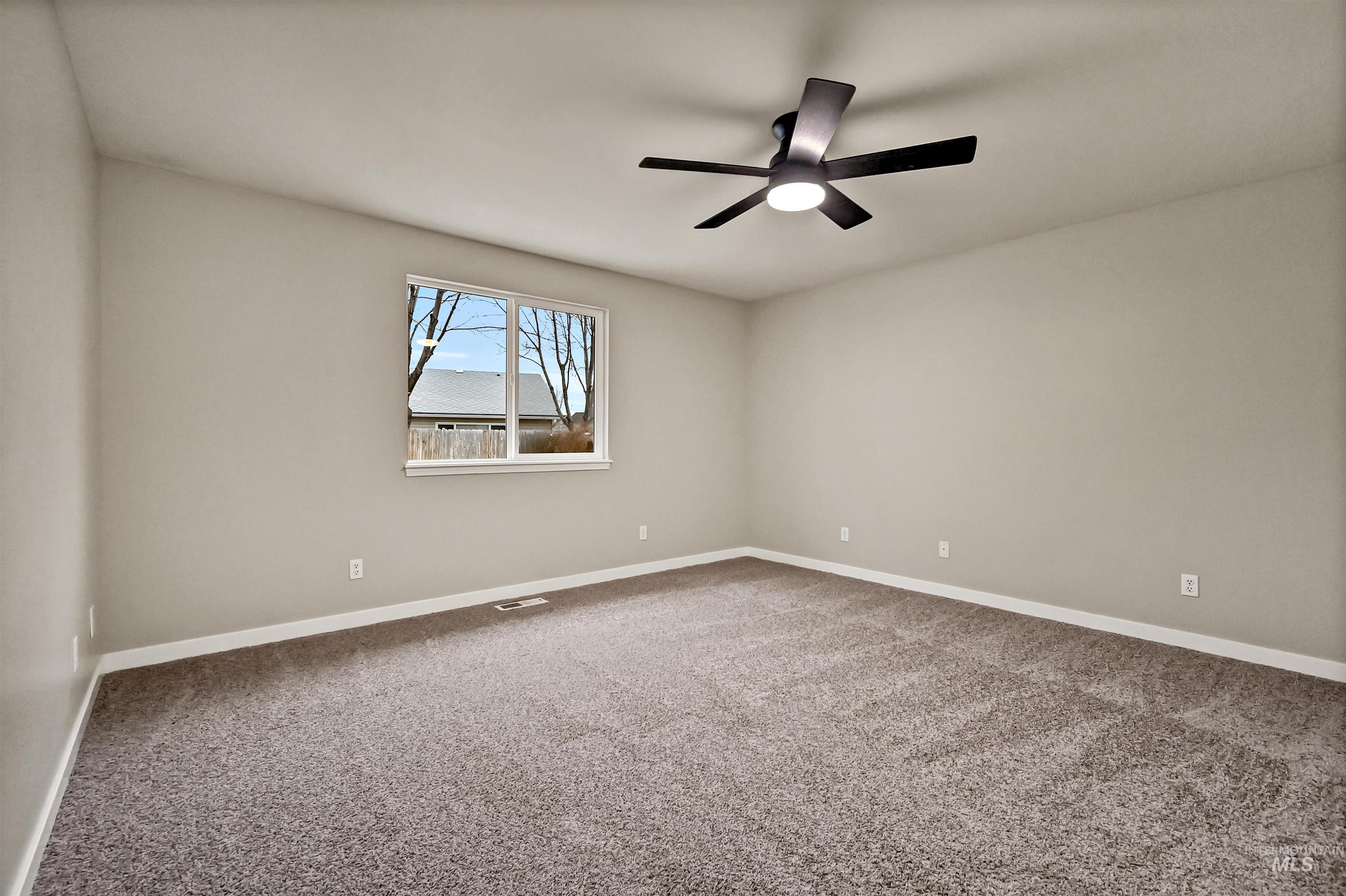 366 West Harris Street Meridian, ID 83642 - Photo 16 of 31 Unfurnished room featuring light carpet and a ceiling fan