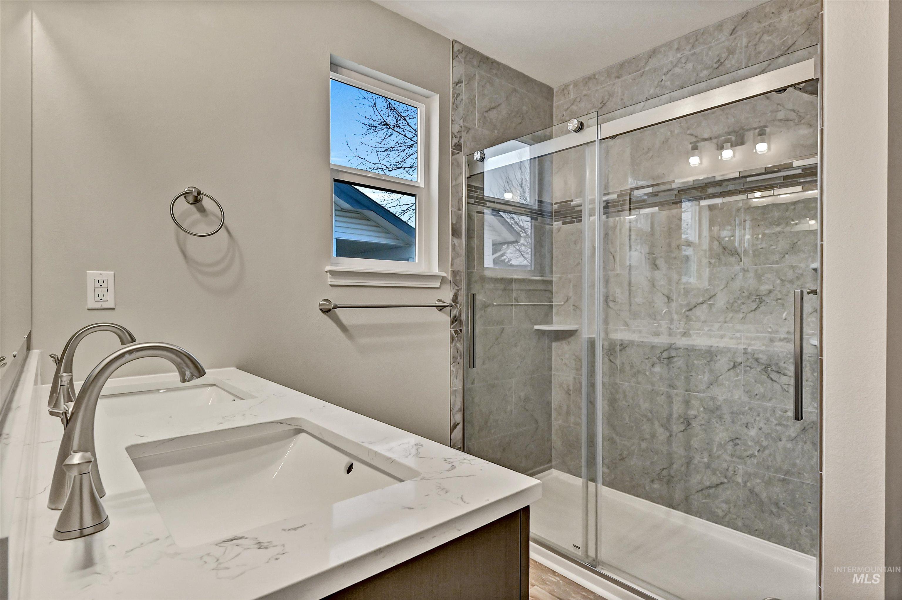 366 West Harris Street Meridian, ID 83642 - Photo 18 of 31 Bathroom featuring double vanity and a marble finish shower