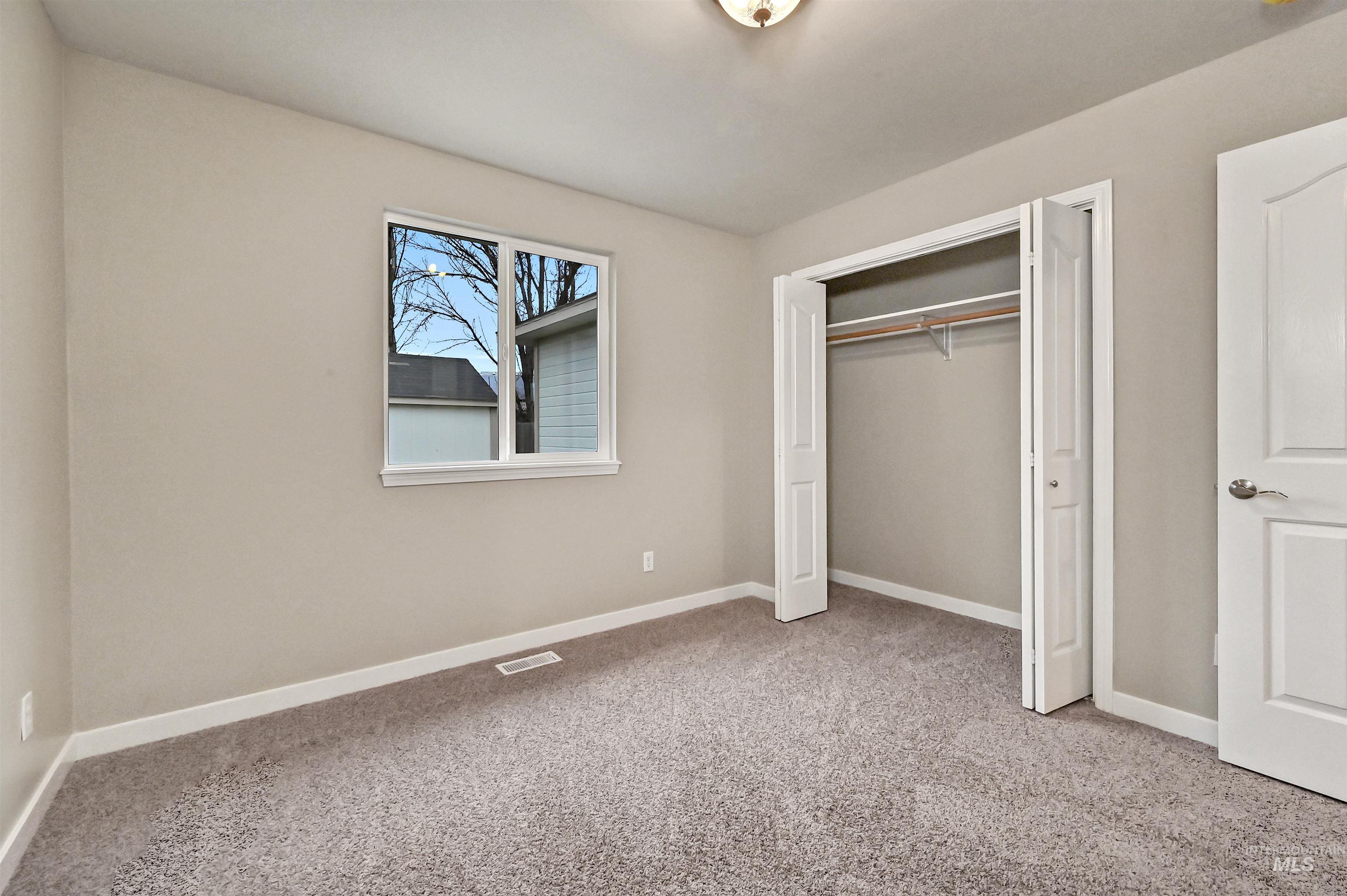 366 West Harris Street Meridian, ID 83642 - Photo 20 of 31 Unfurnished bedroom with light colored carpet and a closet