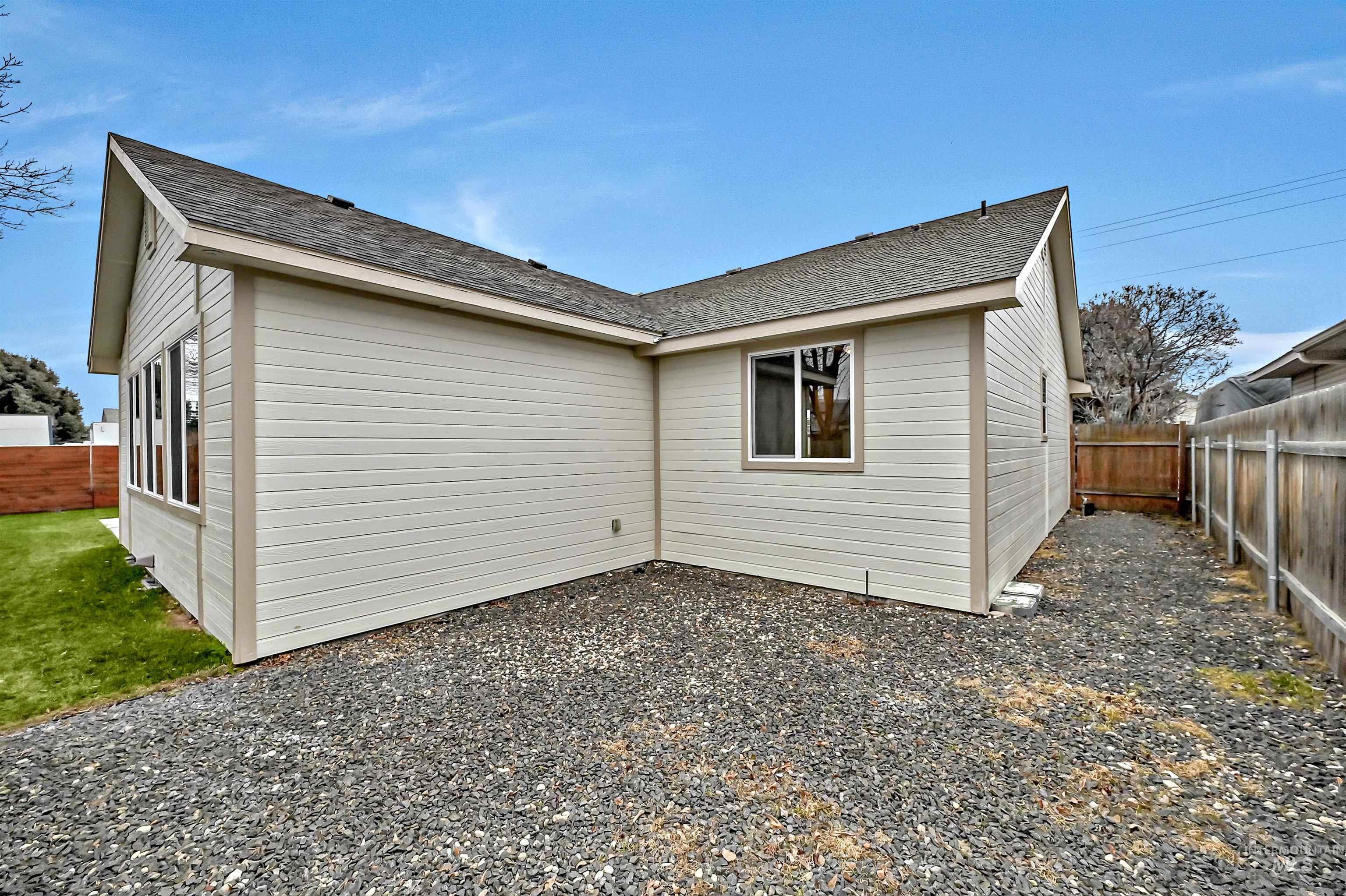 366 West Harris Street Meridian, ID 83642 - Photo 29 of 31 Rear view of house with a fenced backyard and roof with shingles