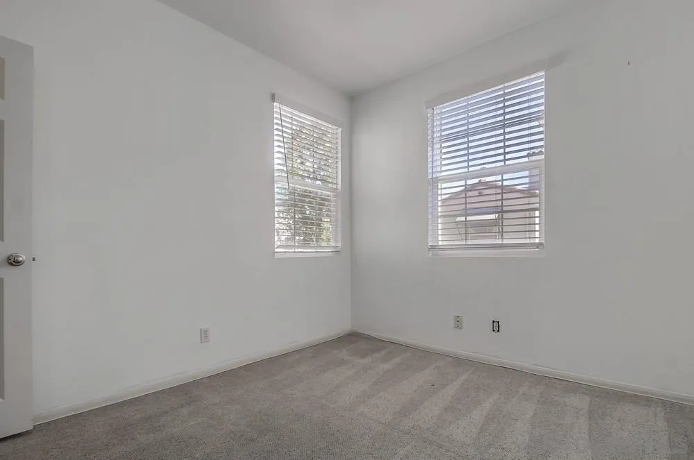 1298 Fools Gold Way, Unit 4 Chula Vista, CA 91913 - Photo 28 of 38 an empty room with windows