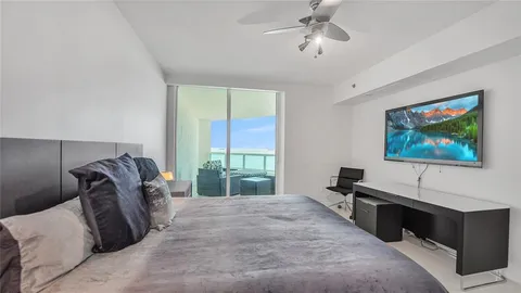 a bathroom with a shower and a sink