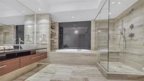 a bathroom with a shower and a toilet