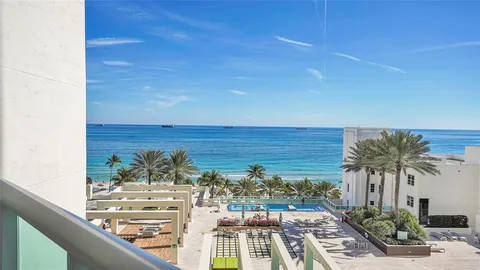 swimming pool view with a outdoor seating space