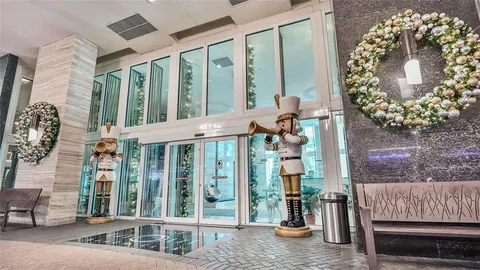 a view of a building with car parked