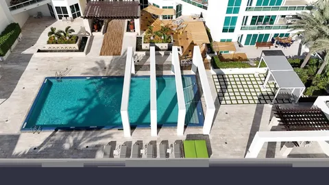 a front view of a building with a garden