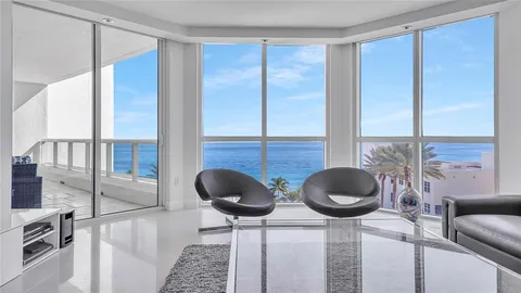 a kitchen with granite countertop a sink a stove and a wooden floor