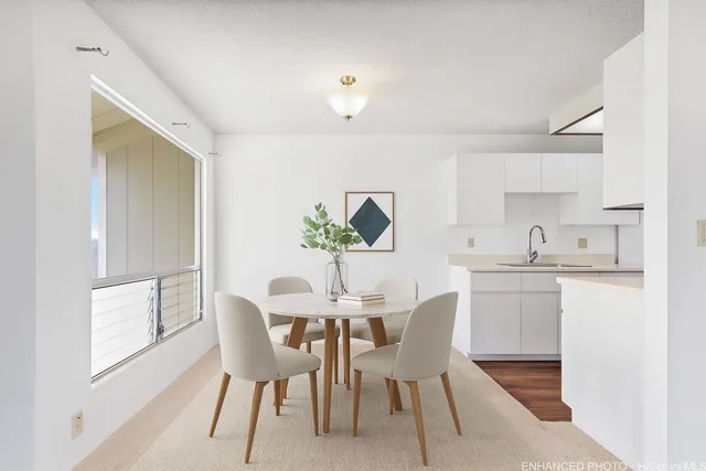 a view of a dining room with furniture and window