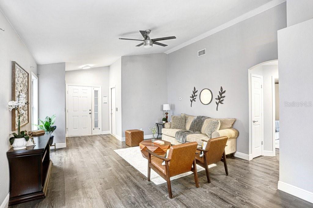807 Cape Cod Circle Valrico, FL 33594 - Photo 6 of 26 a living room with furniture and wooden floor