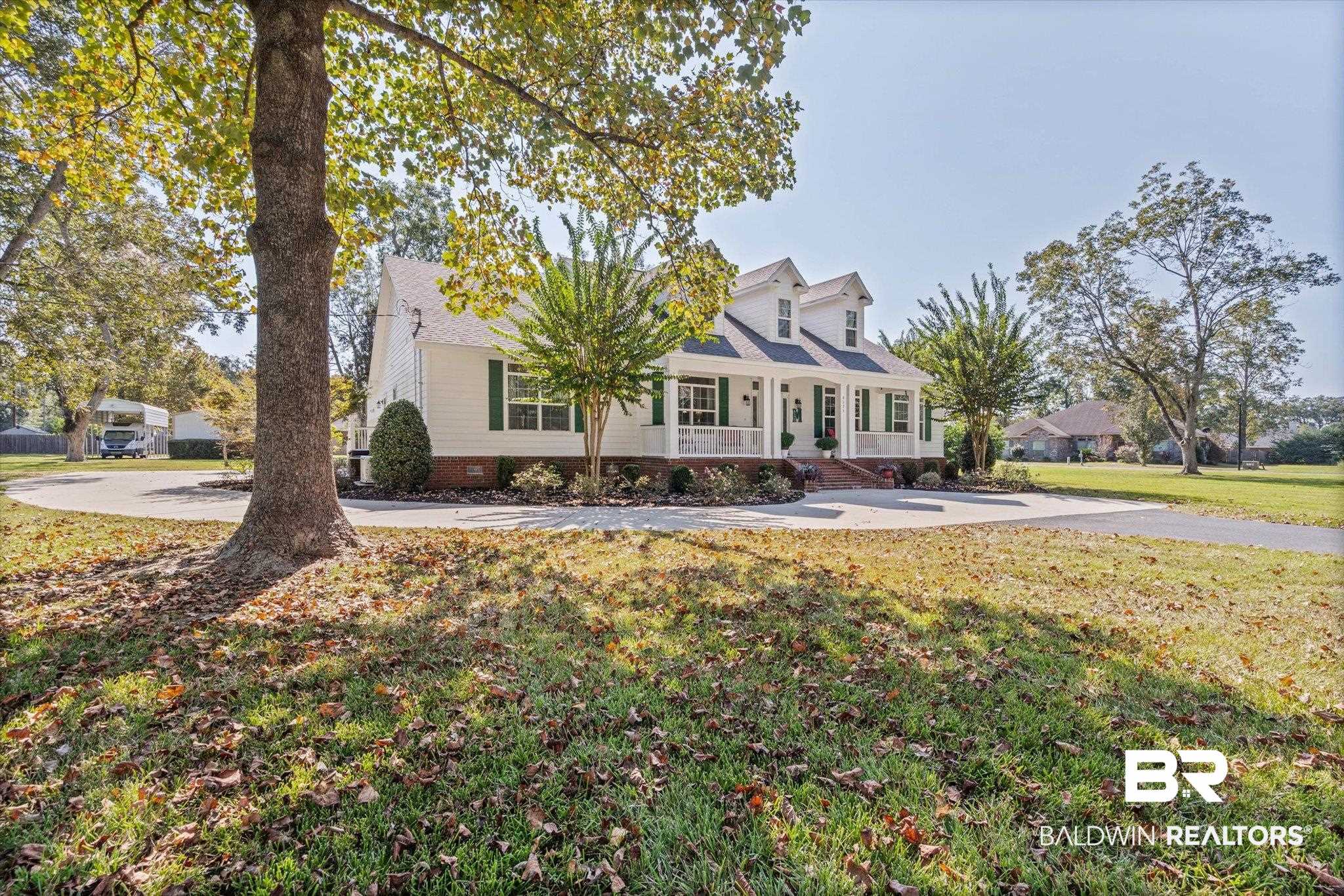 6175 South Grand Bay Wilmer Road Grand Bay, AL 36541 - Photo 34 of 42 Cape cod-style house with a front yard and covered porch