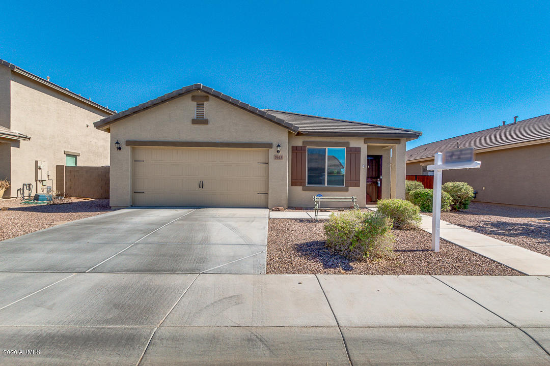 7615 West Carter Road Laveen, AZ 85339 - Photo 1 of 34 a view of a house with a yard