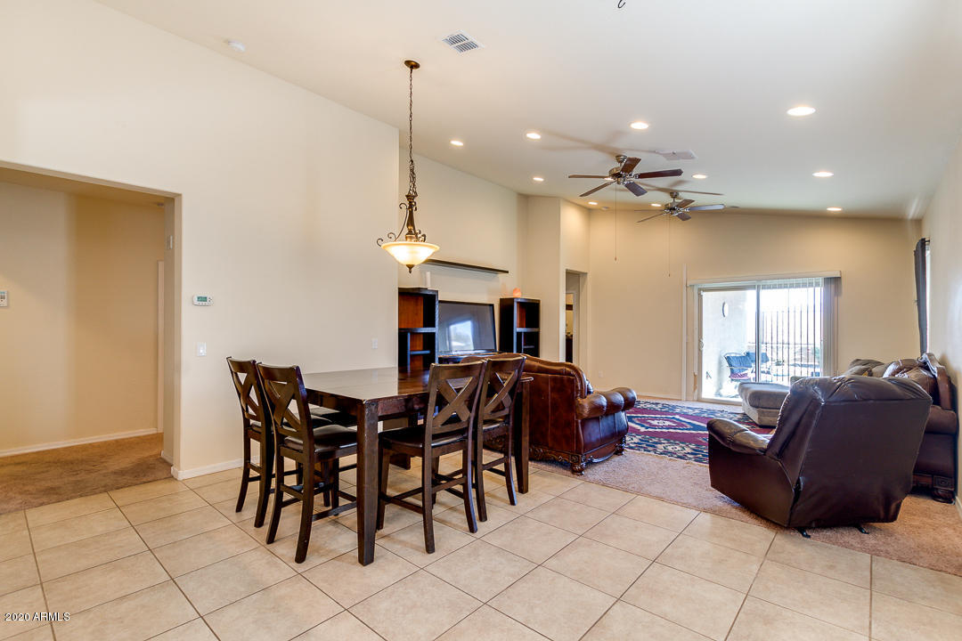 7615 West Carter Road Laveen, AZ 85339 - Photo 12 of 34 a view of a livingroom with furniture and window