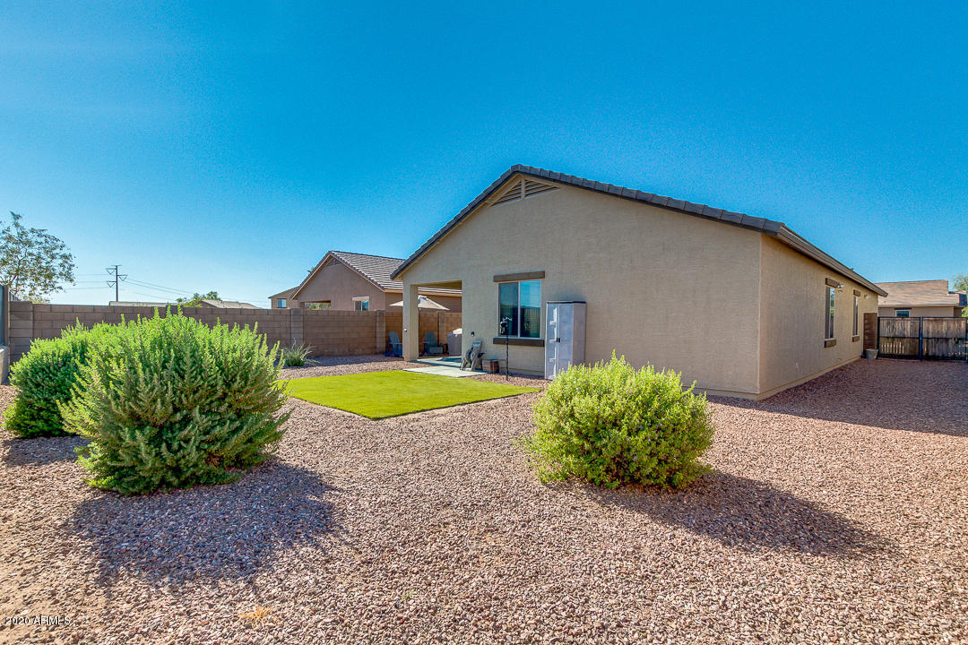 7615 West Carter Road Laveen, AZ 85339 - Photo 29 of 34 a front view of a house with garden