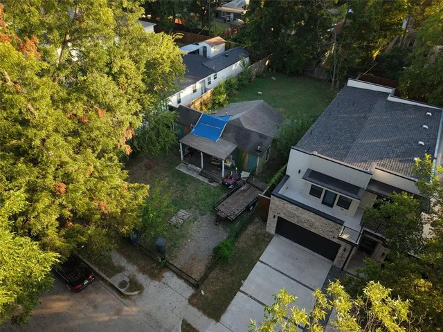 an aerial view of a house with a garden