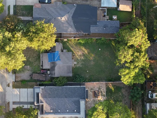 an aerial view of a house with a garden