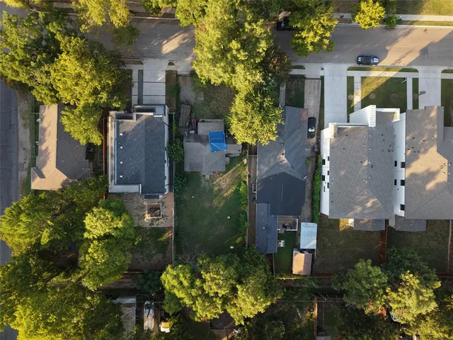 an aerial view of a house with a yard and garden
