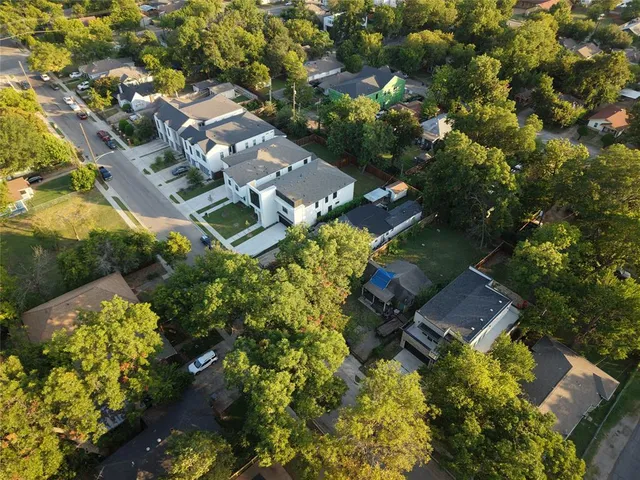 a aerial view of a house with a yard and garden