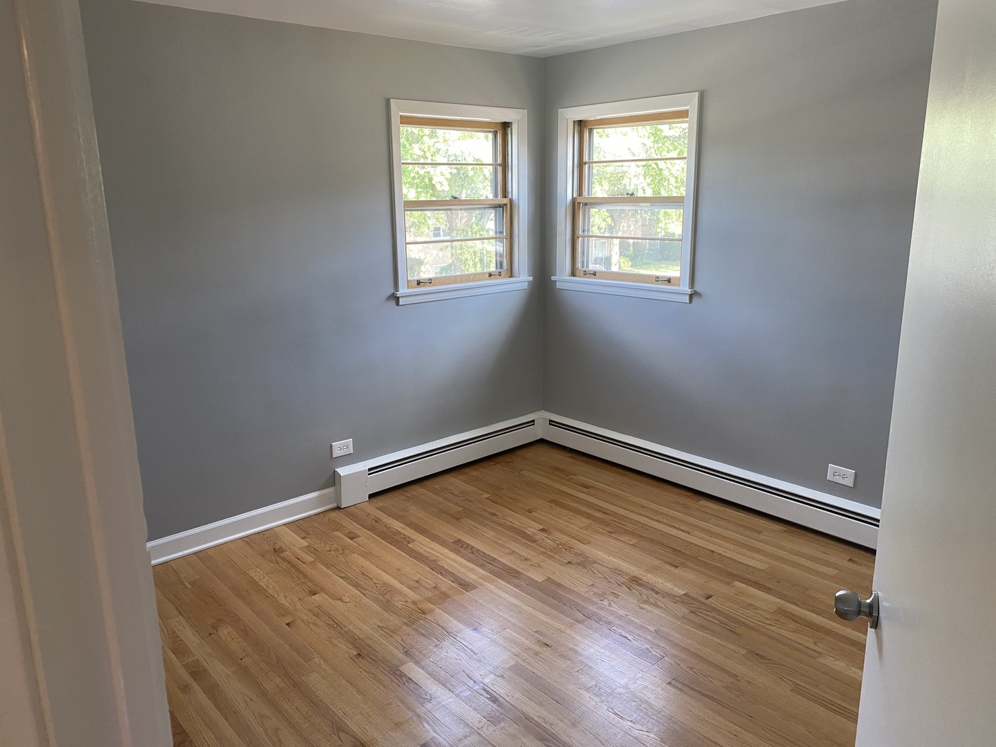 2259 South 17th Avenue, Unit 2F North Riverside, IL 60546 - Photo 10 of 12 an empty room with wooden floor and windows