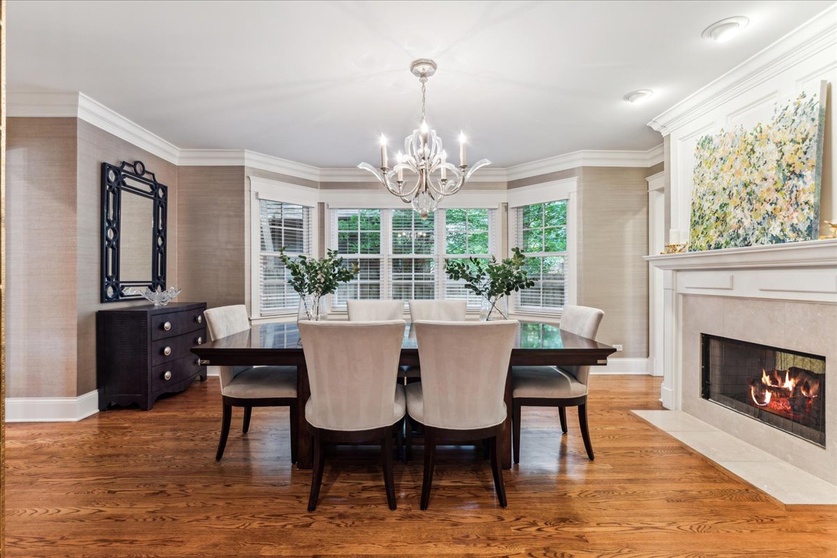 1407 Tower Road Winnetka, IL 60093 - Photo 7 of 37 a view of a dining room with furniture window and wooden floor