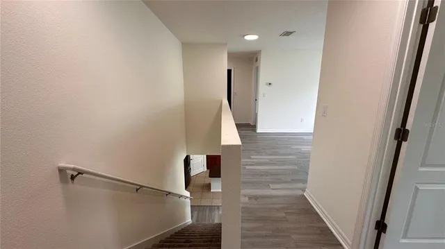 a bathroom with a bathtub shower sink vanity and a toilet