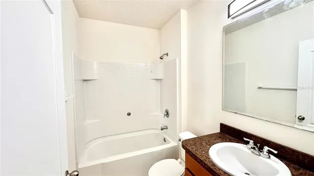 a swimming pool with trees in the background