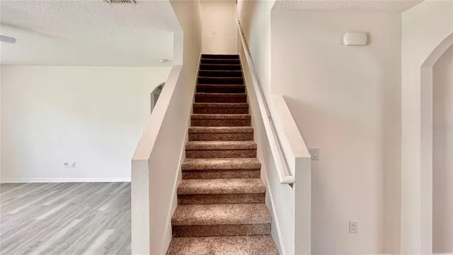 a bathroom with a granite countertop shower sink and toilet